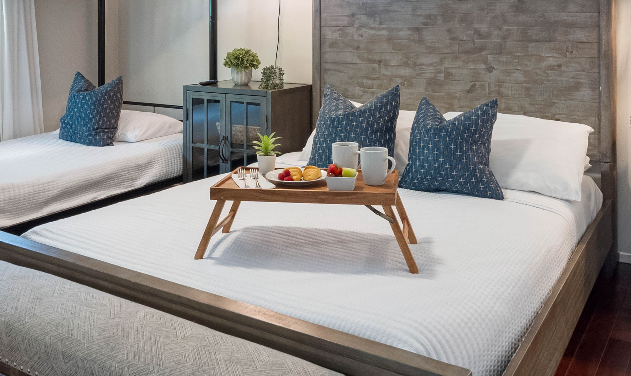 This bedroom combines modern style with practicality, offering multiple sleeping options.
