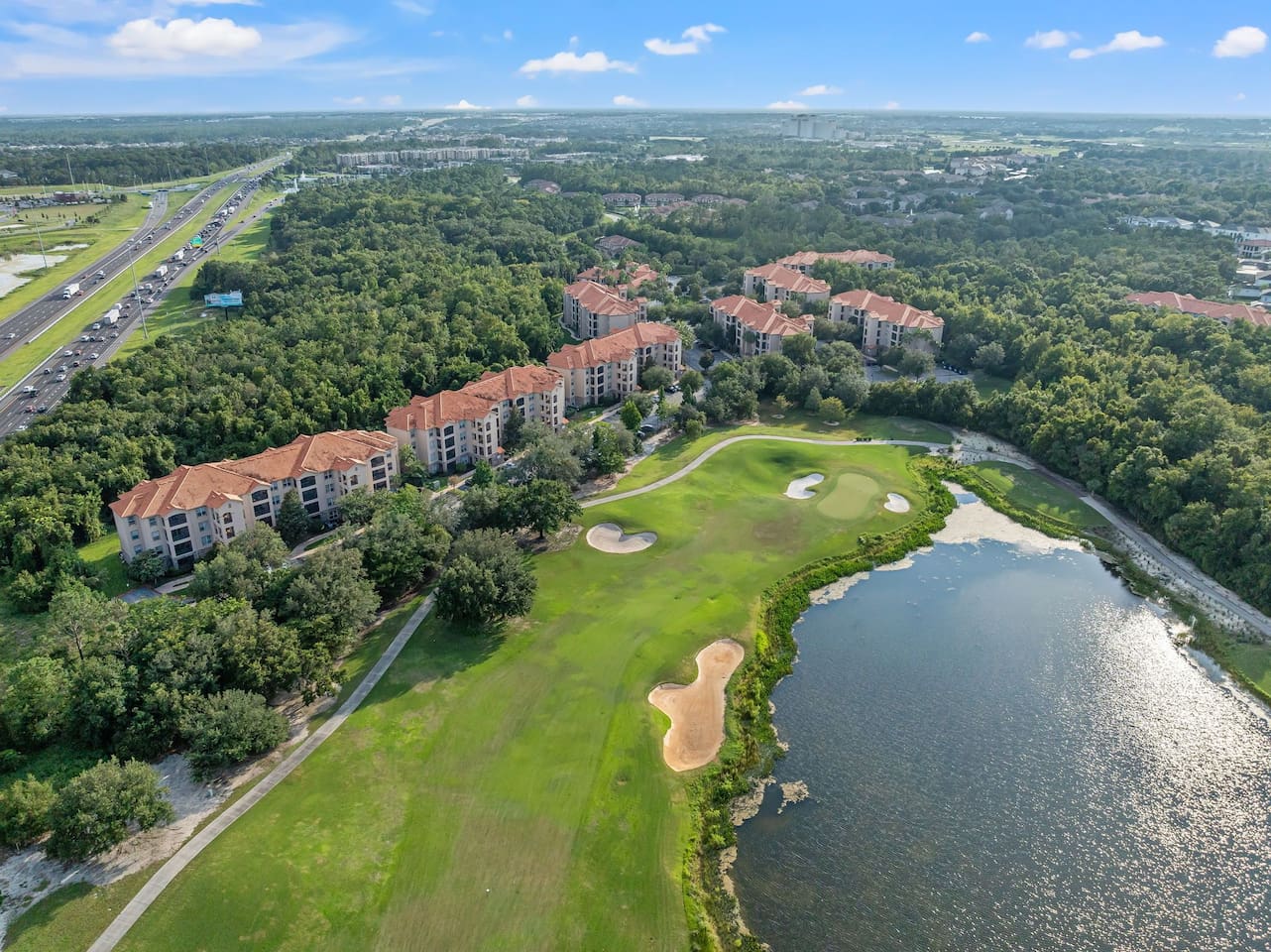 A stunning view of the lush golf course and lake.
