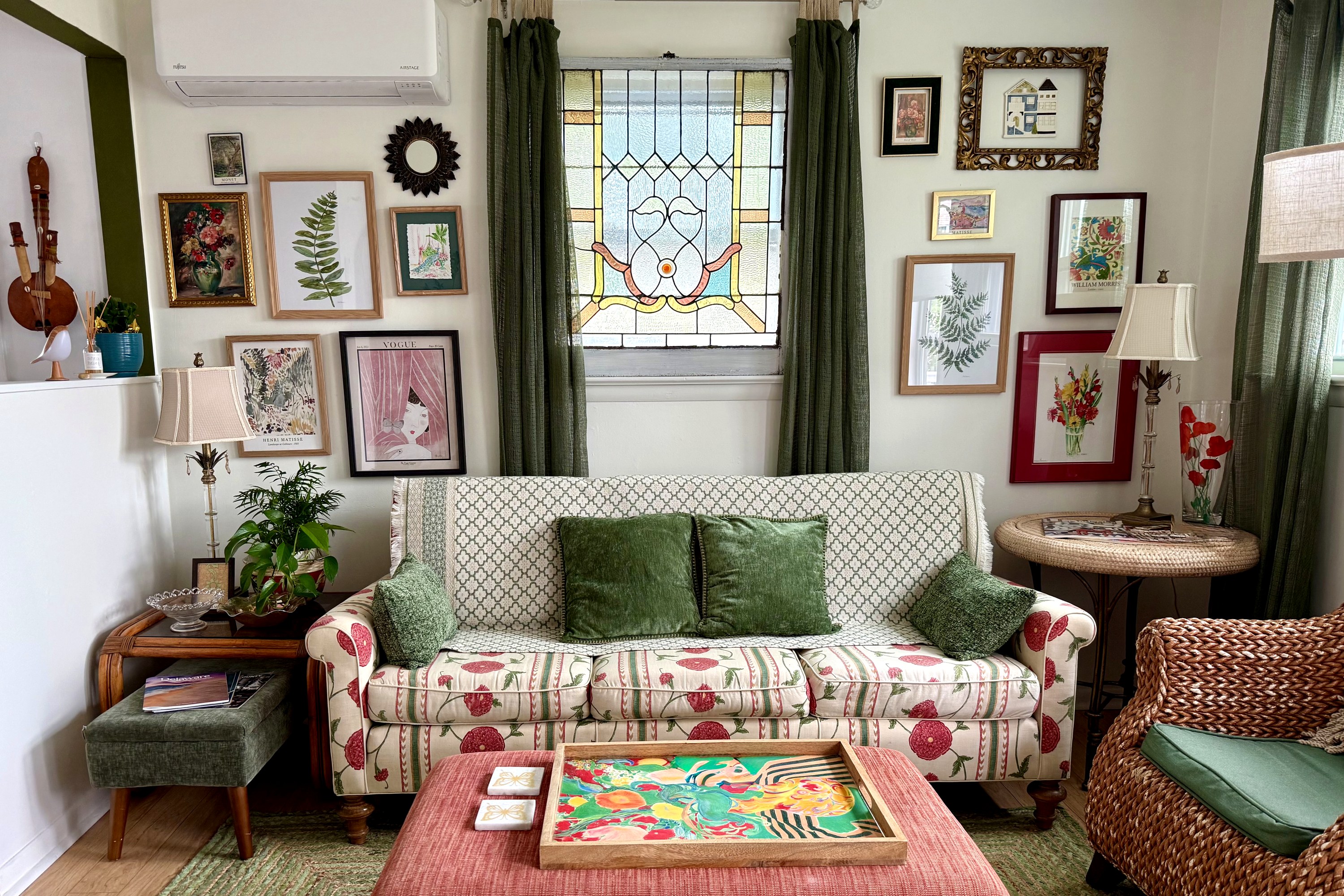 Bright and happy, that’s what we wanted, that anthropology style sofa, and the vintage stained glass set the tone for a cheerful space 