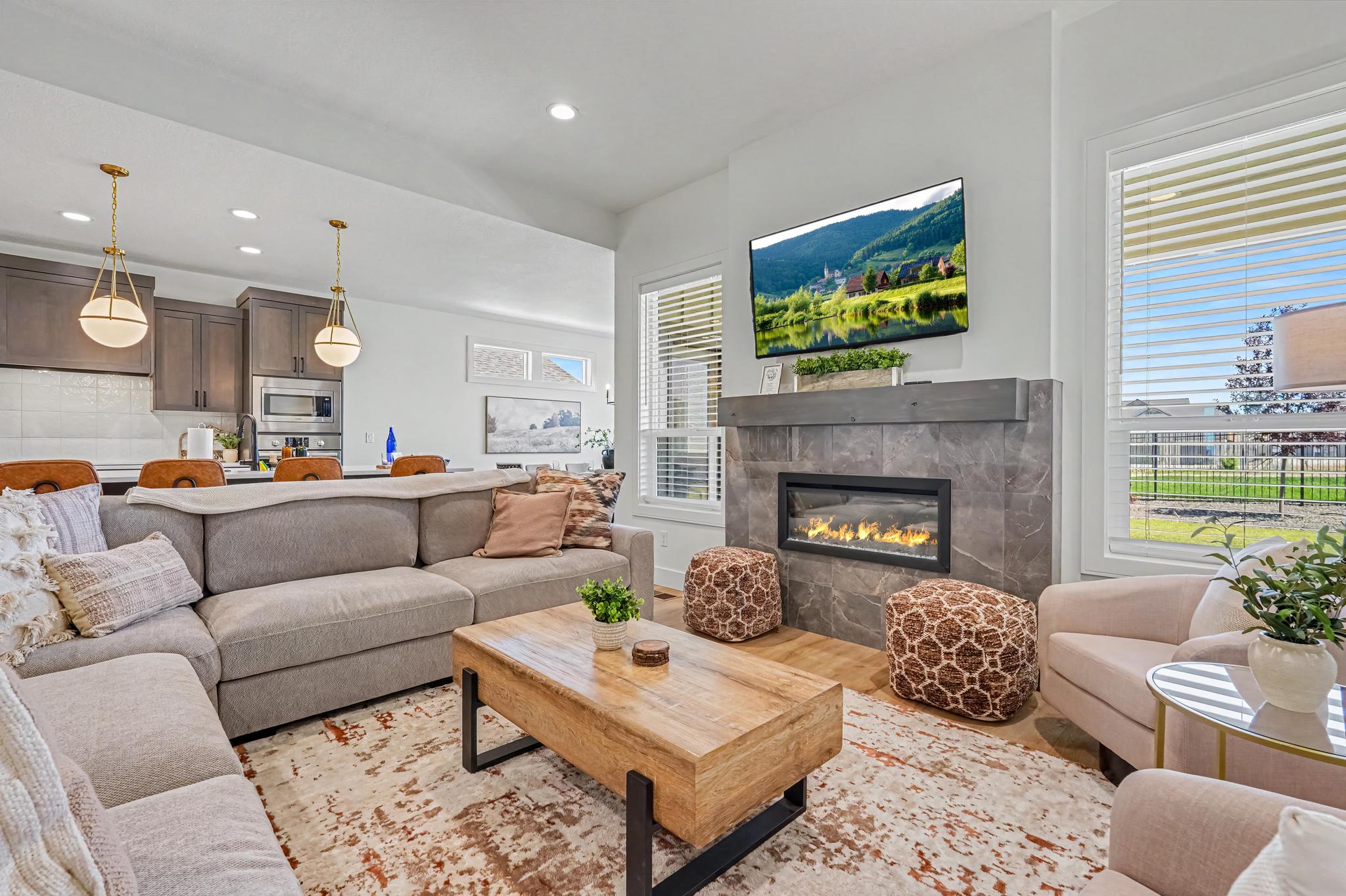 Relax in the inviting living room with a Smart TV and cozy fireplace.