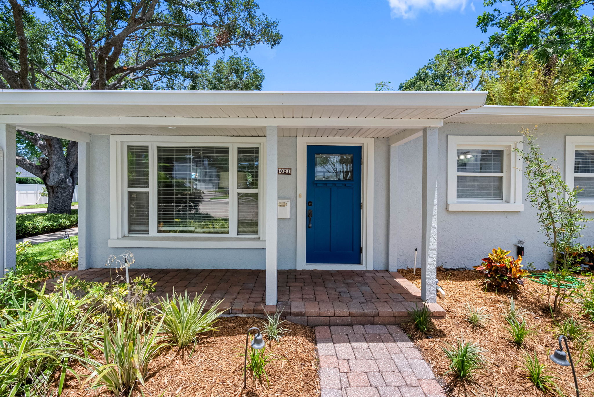 From the moment you arrive at Bayshore Bungalow, you'll be greeted by charming curb appeal and lush landscaping that set the tone for a relaxed and memorable stay.