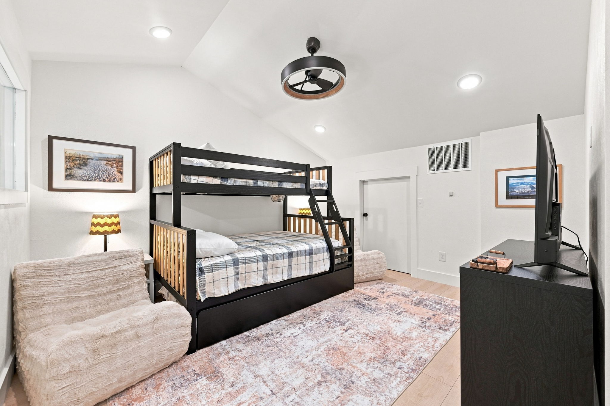 A twin-over-full bunk, smart TV, and plush chairs make this the perfect spot for kids and guests to relax, unwind, and enjoy a little downtime.