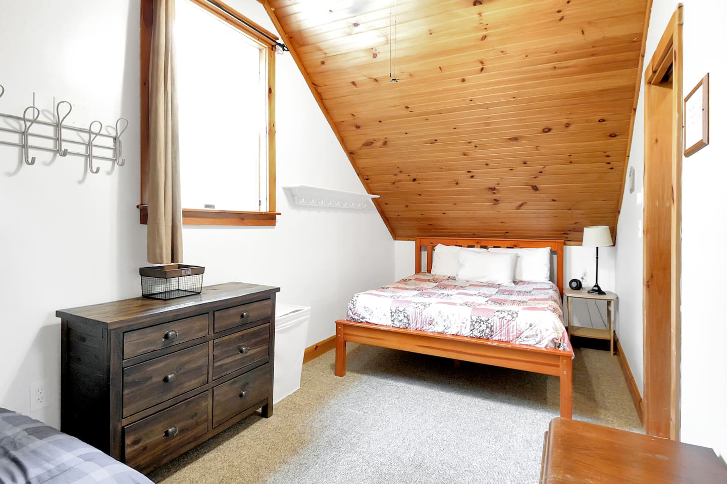 A cozy double bed located in the second bedroom of the home! 