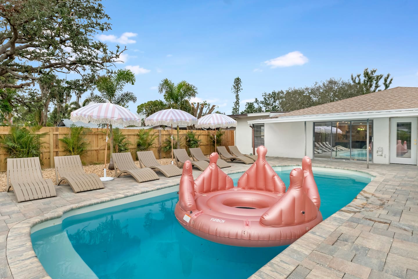 Massive Heated Saltwater Pool with Lush Tropical Landscaping, Games and Pool Cabana Game Room.