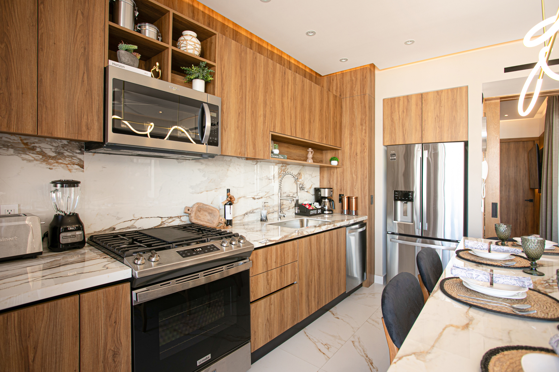 A sleek, fully stocked kitchen with a spacious island and dedicated coffee bar—everything you need to cook, sip, and feel at home.