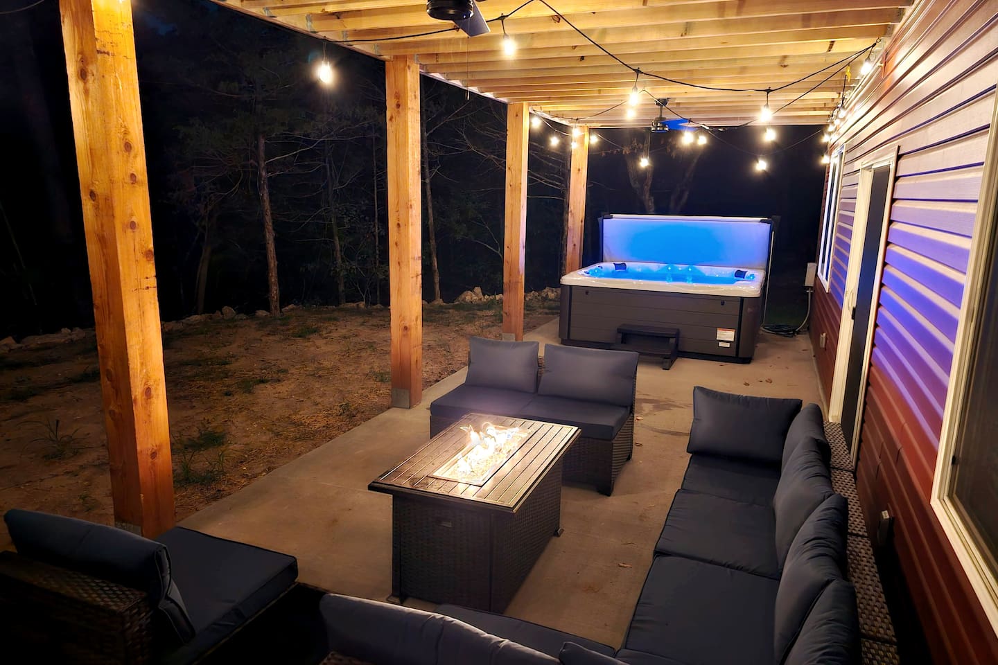 Evenings made easy with cozy seating and a fire table on the covered patio.