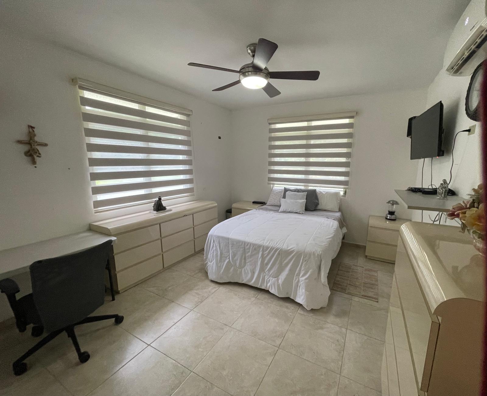 second bedroom with queen