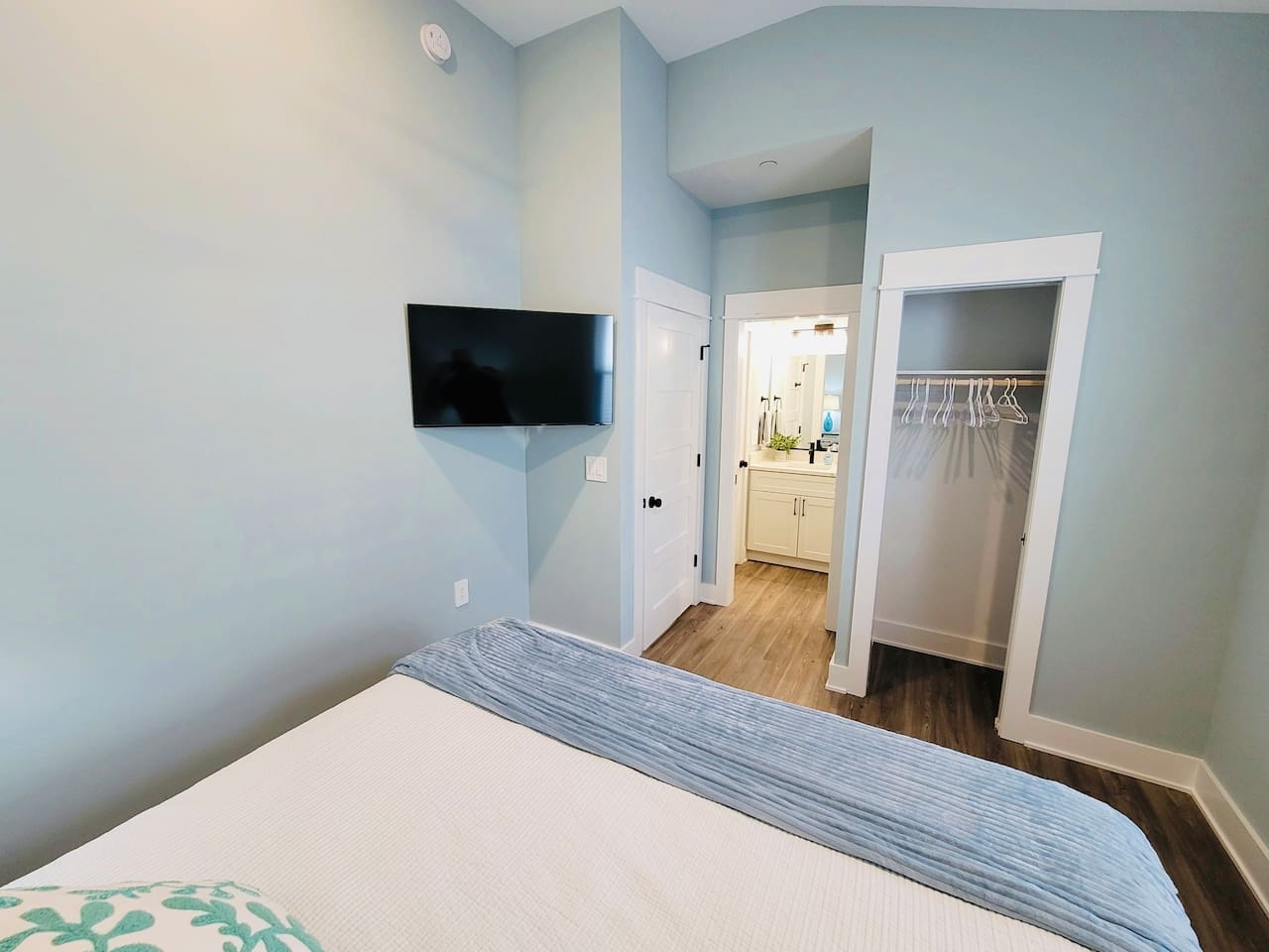 King bedroom has direct access via pocket door to the guest bathroom.   Also has large closet with shelves.