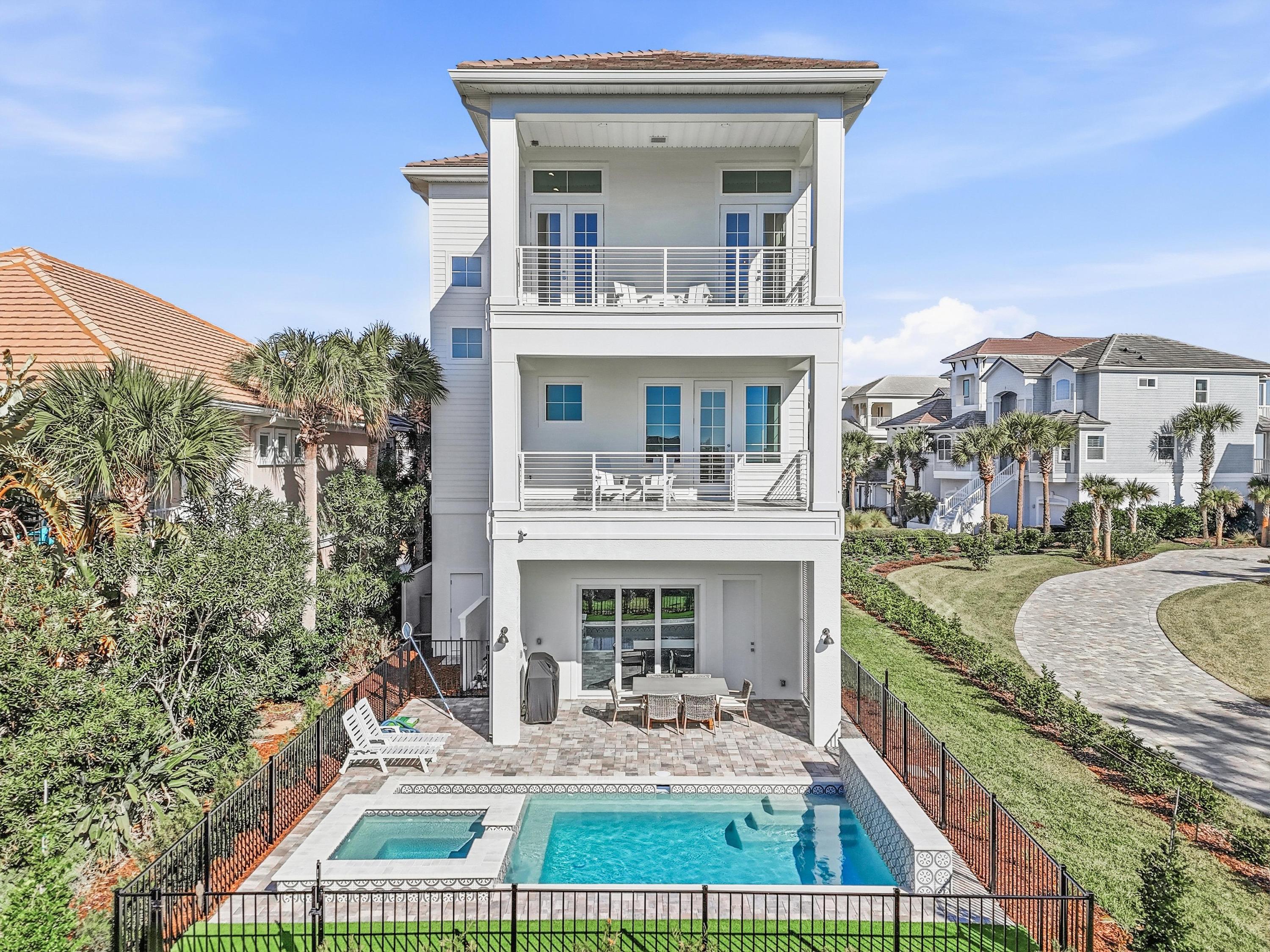 One house. Three levels of “together.” Breakfast on the top balcony, pool laughs in the backyard, and dinner on the shaded patio while the kids dry off—then everyone piles into bed happy-tired from a perfect beach day.
