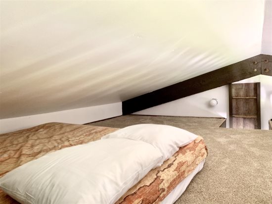 Loft area: Full-size bed.