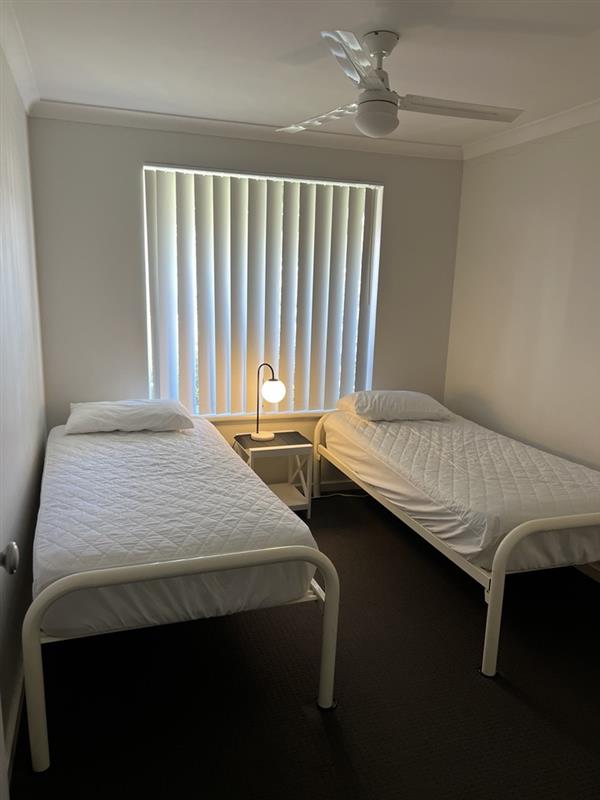 Bedroom 3 with 2 single beds & built-in robe