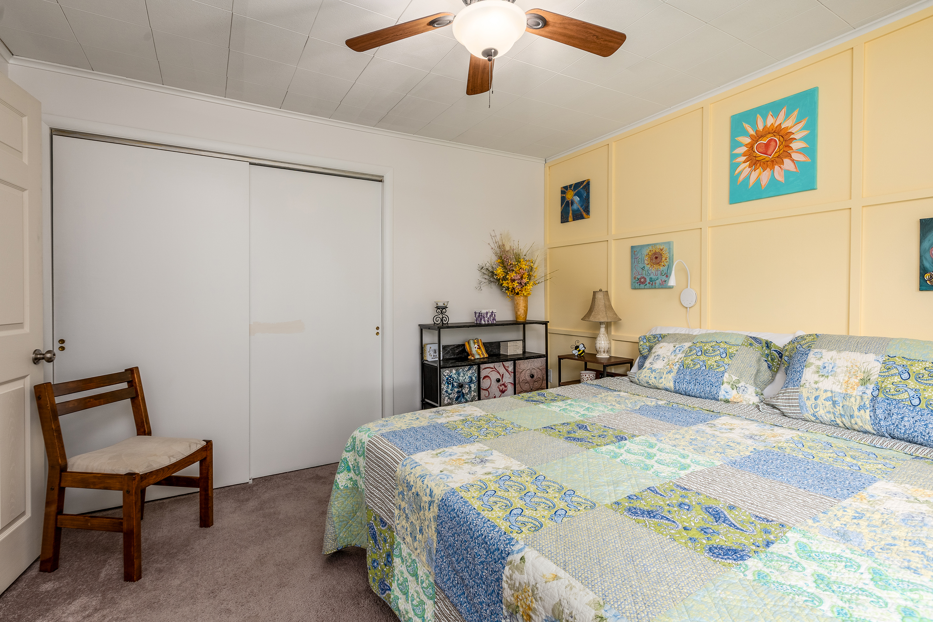 Bedroom 1: With nightstands, lamps, a soft-sided dresser, and closet space, this bedroom blends comfort and function.