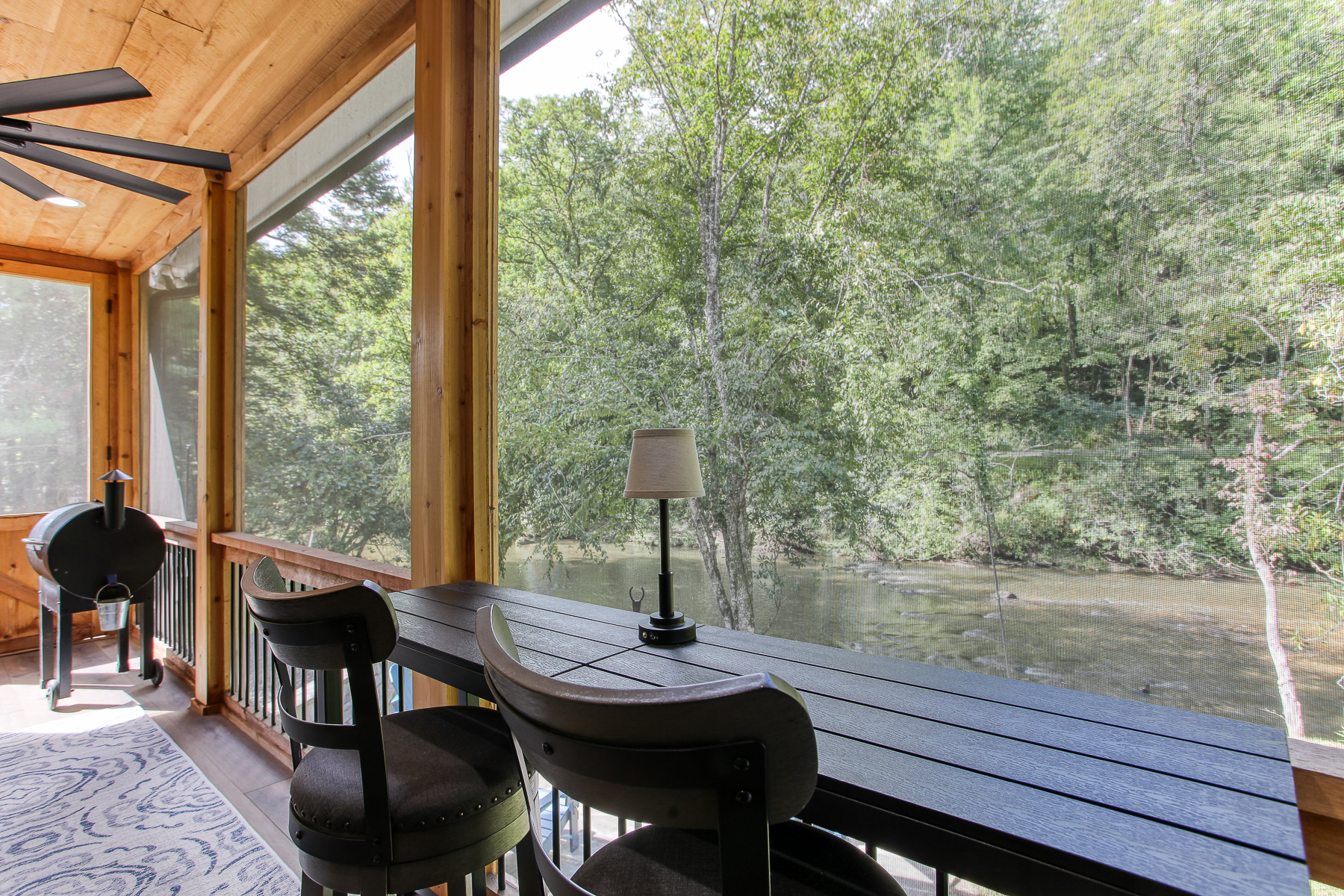 Sip your morning coffee at the porch counter overlooking the water at Robbin’s Nest on Snowbird Creek.