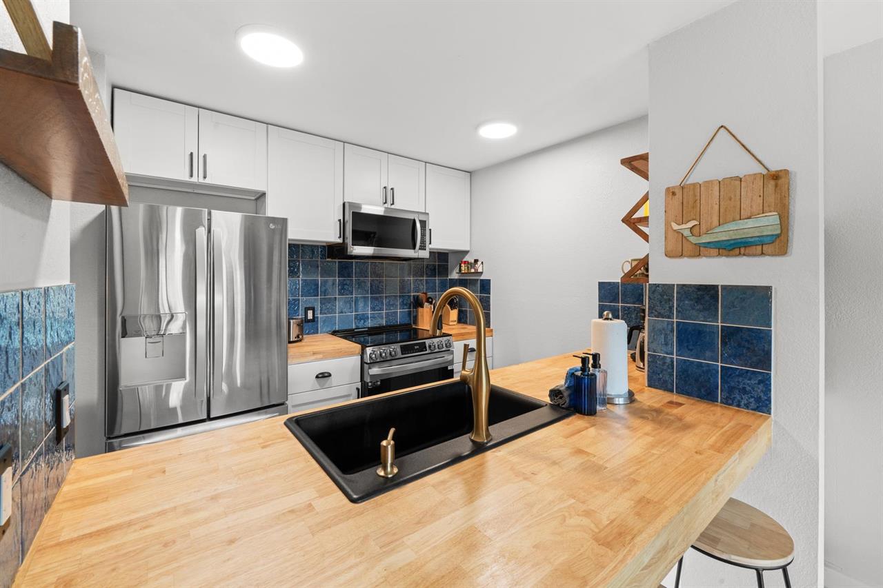 Fresh modern kitchen with wooden countertops