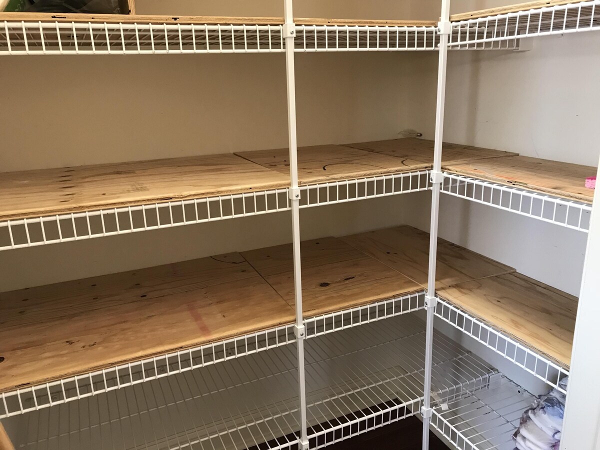 pantry w/ lots of shelving and room for all your food storage 