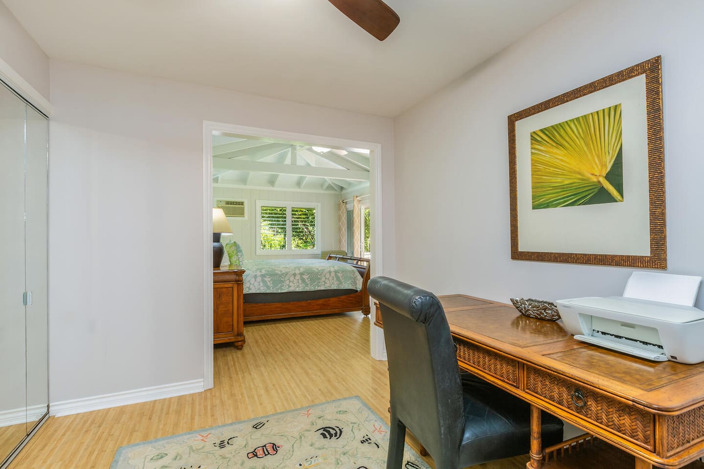 Study area with a bamboo desk and printer.