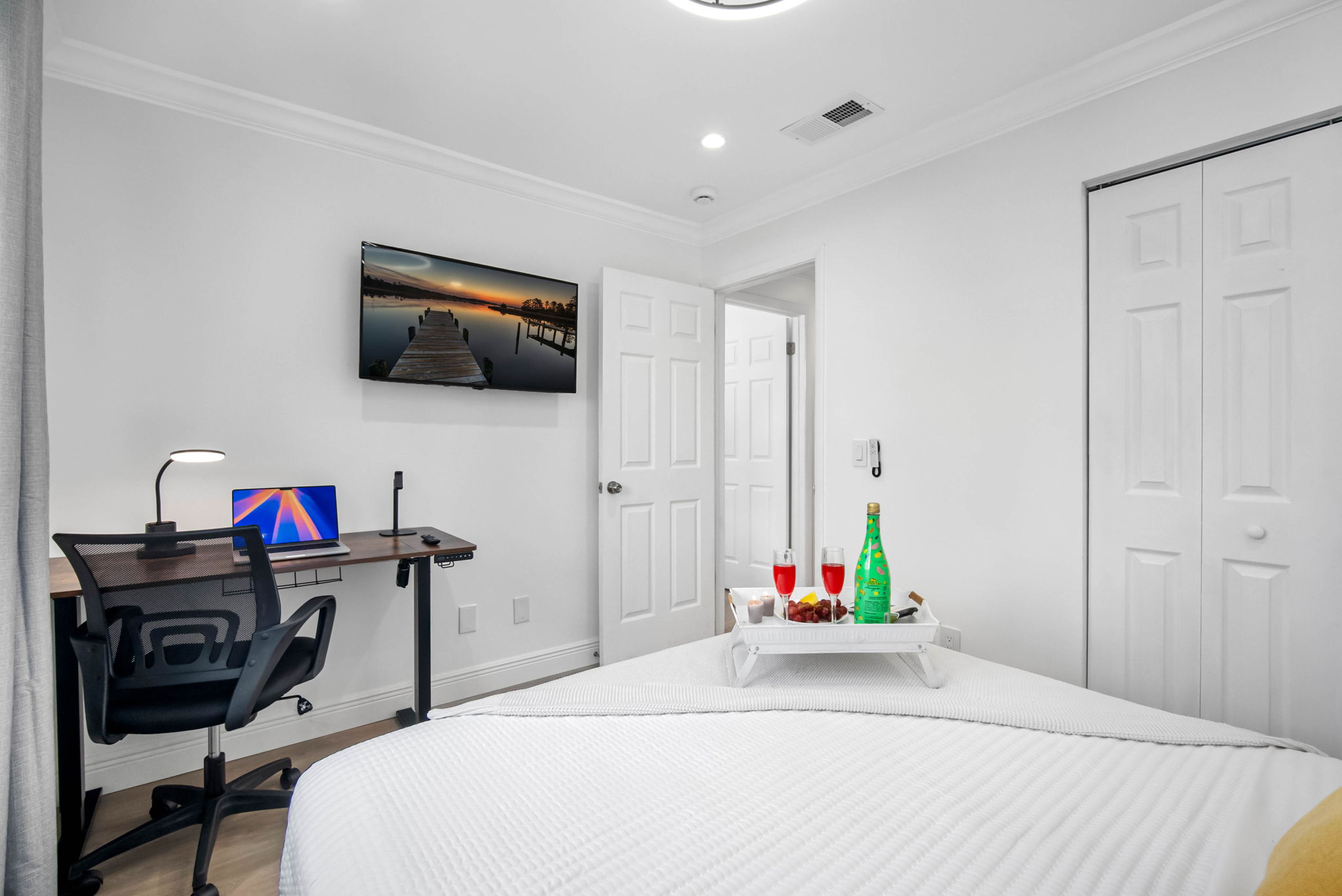Tucked away for privacy, this bedroom offers a peaceful setting for rest, reading, or remote work.