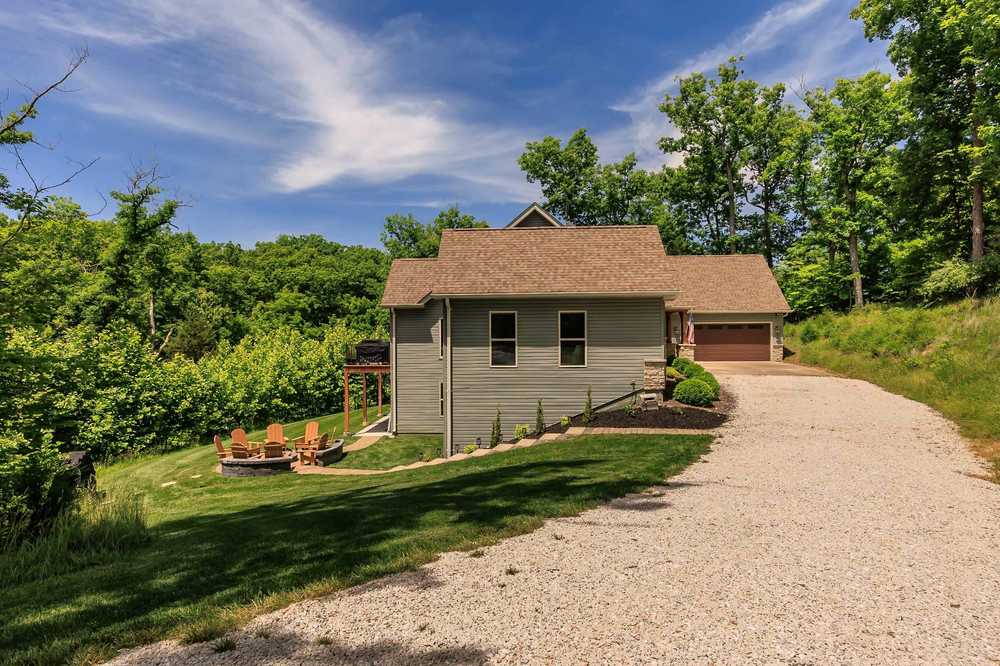 Long driveway provides ample parking for multiple vehicles.