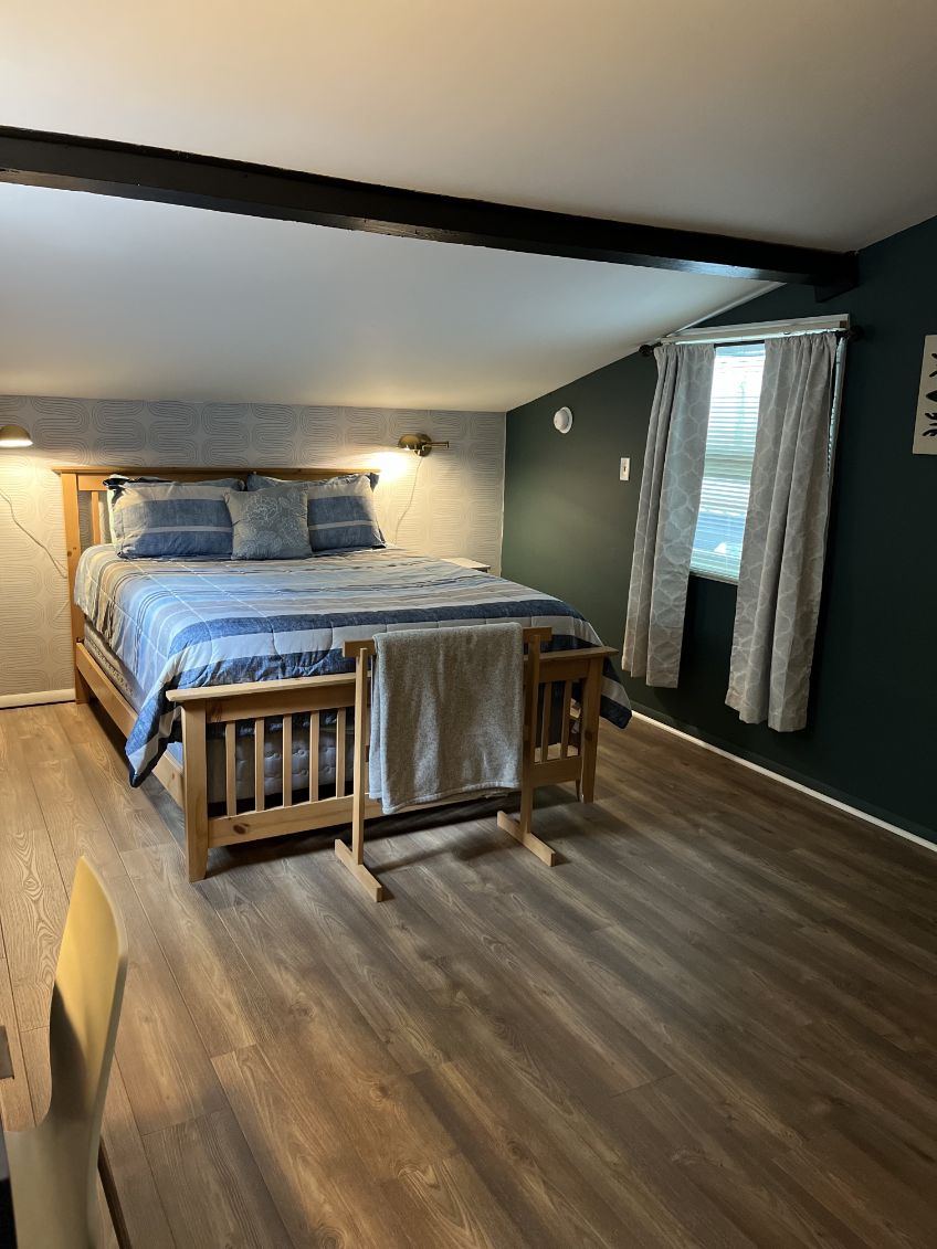 Loft bedroom with a queen bed