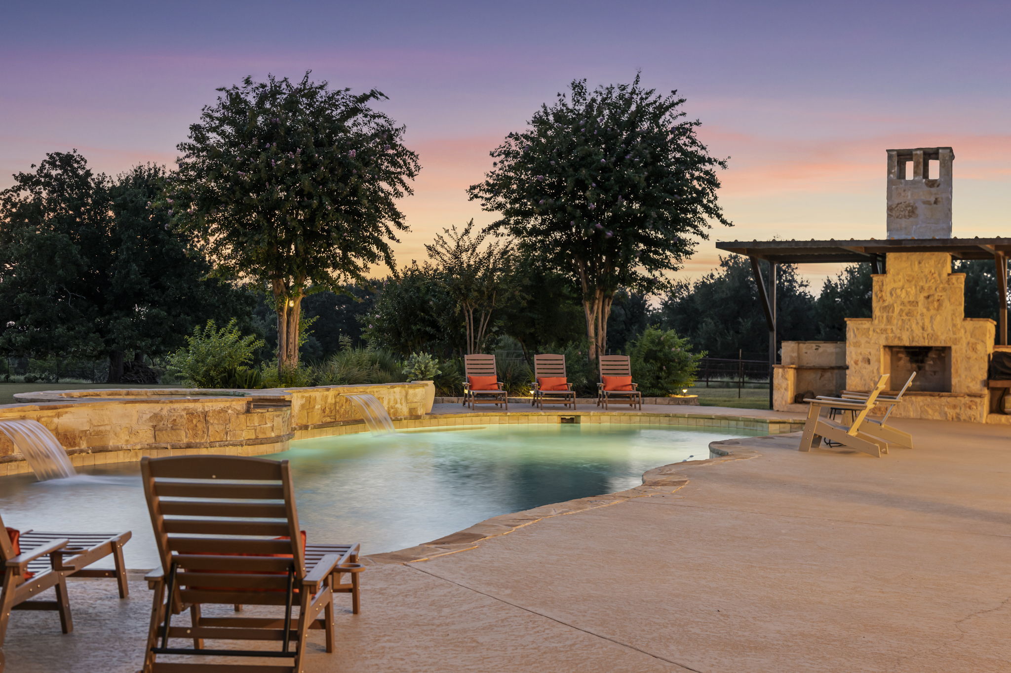 Evening tranquility by the poolside fireplace.