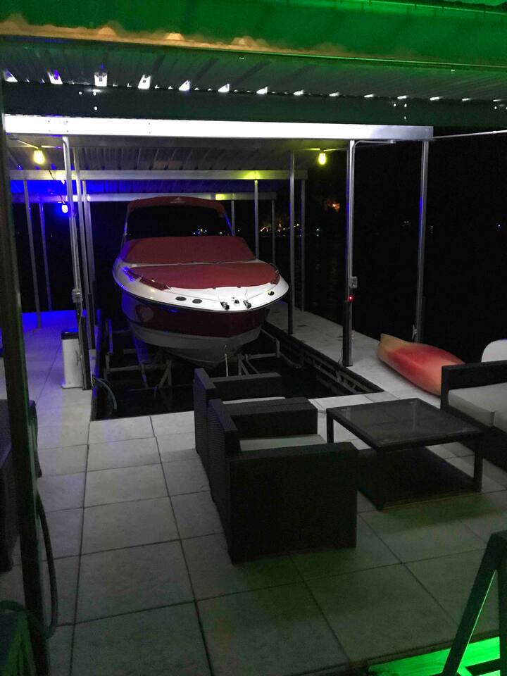 Lights on the dock at night for fishing and lounging. Owner's boat/lift (not part of rental).