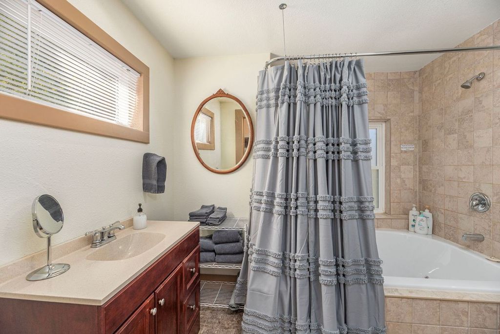 The bathroom has a two person jacuzzi garden tub to relax after a fun day out. 
