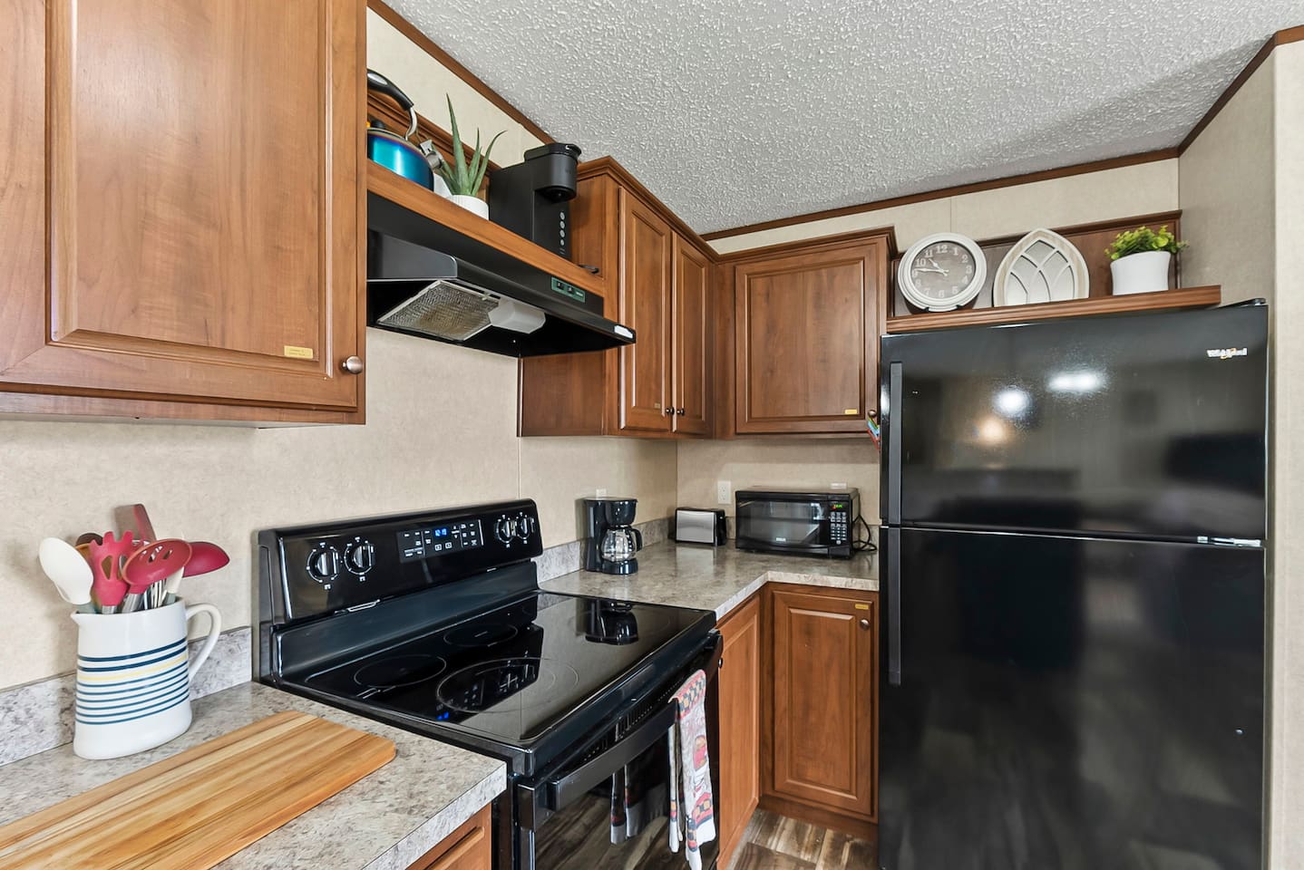 Well-stocked kitchen with coffee maker, microwave, and essentials—perfect for quick breakfasts or relaxed dinners.