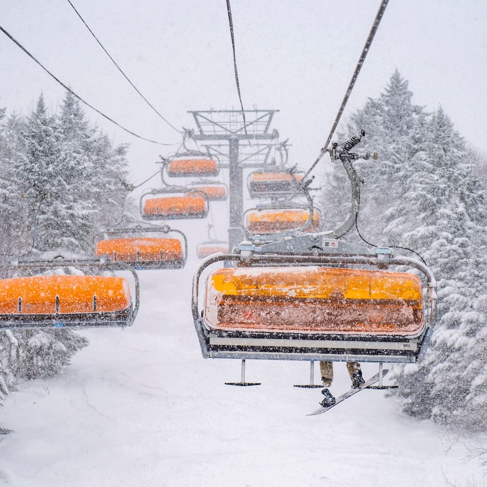 Hop on the chairlifts and soar above the slopes, ready for your next thrilling run down the mountain!