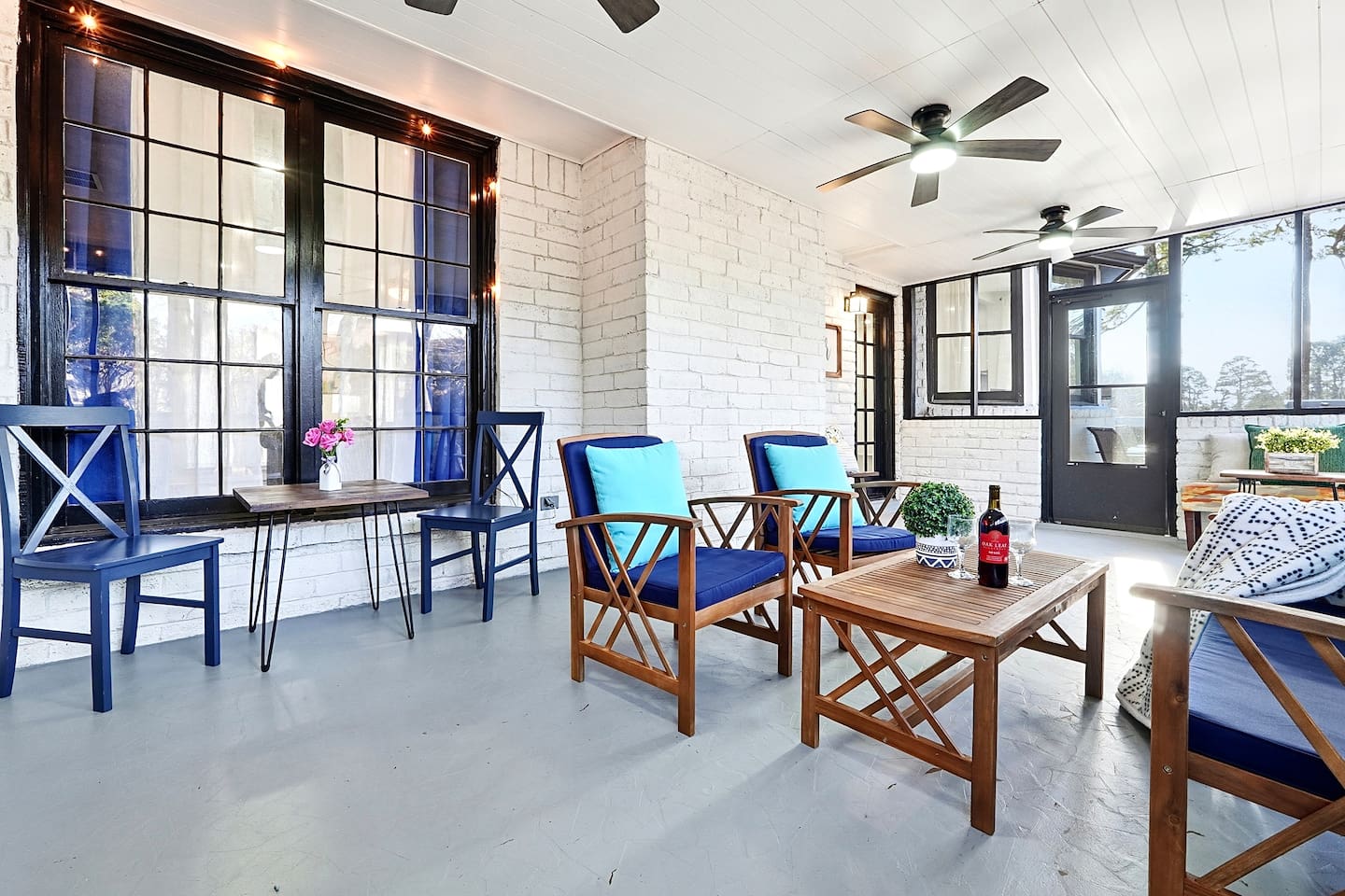 Inviting and spacious sunroom featuring ample seating, perfect for relaxing, unwinding, or spending quality time together.