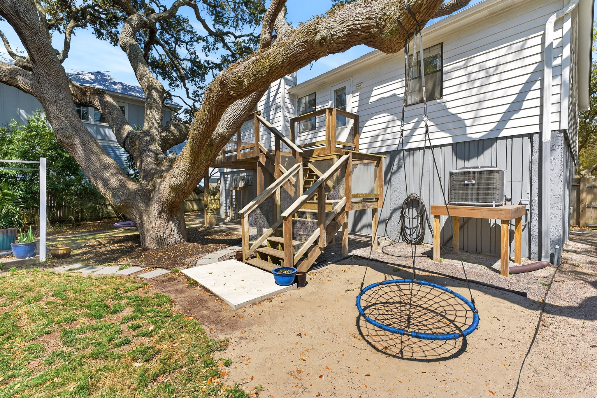 Back of home and tree swing