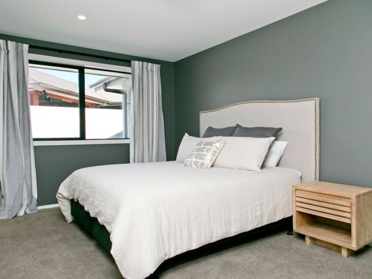 Main Bedroom 1 with Ensuite and TV on wall for bedtime Netflix or lazy mornings.