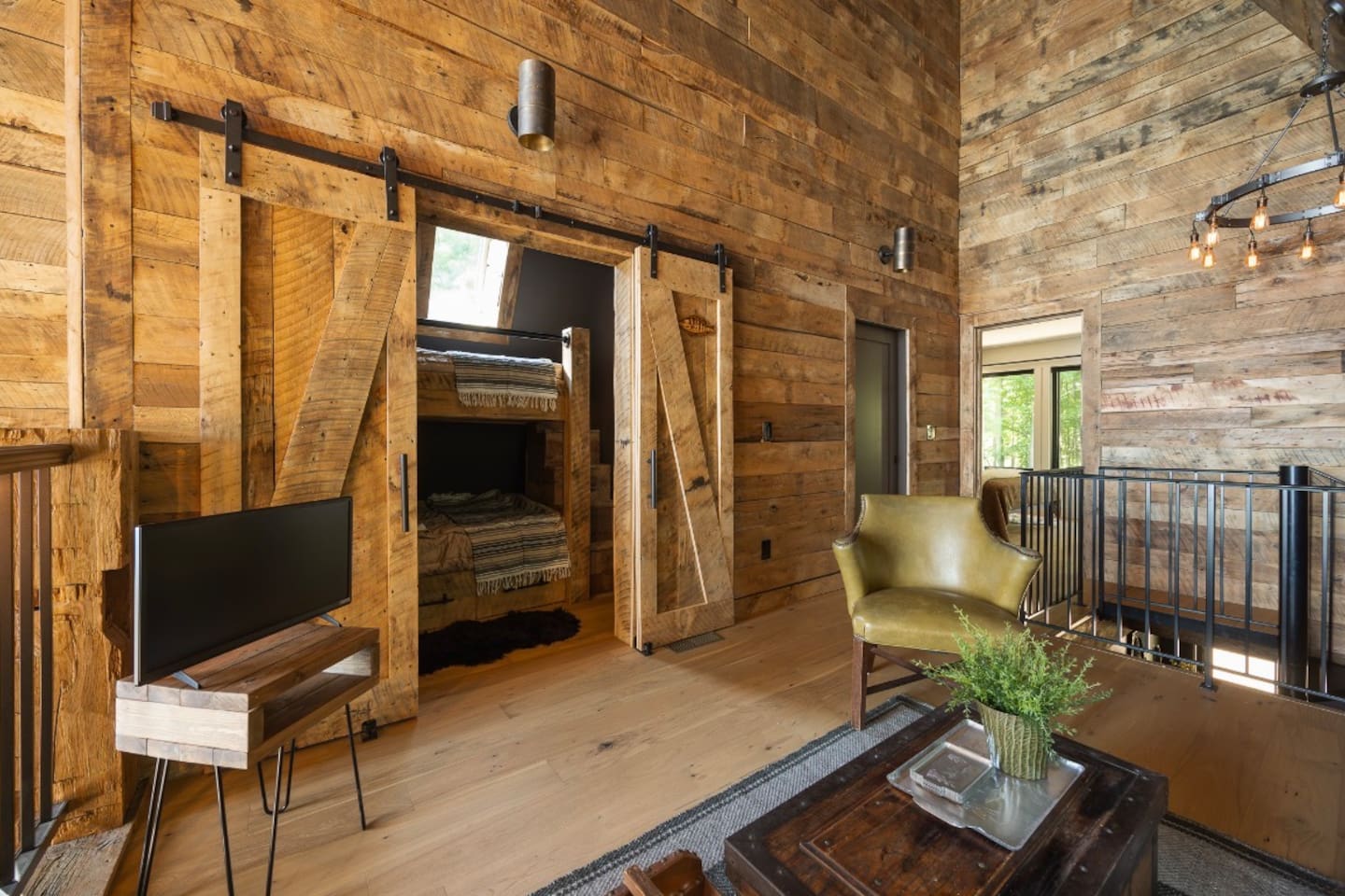 Open loft-style bedroom with private twin-over-queen sleeping area. 