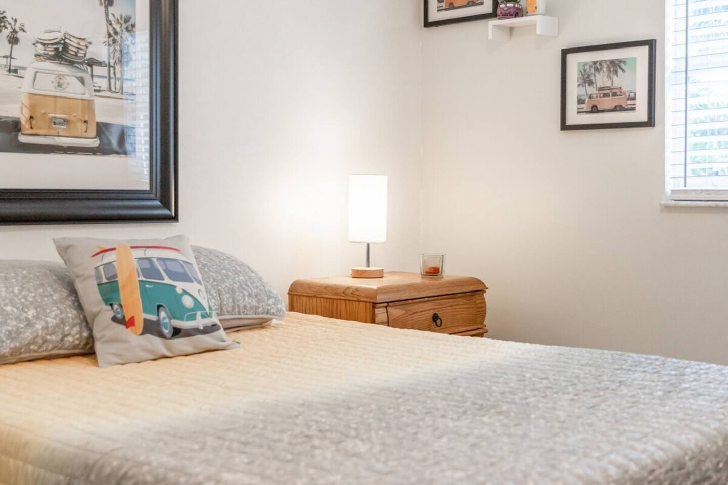 Guest Room suite with 1-queen bed. Beach Wagon themed room and private bathroom. 