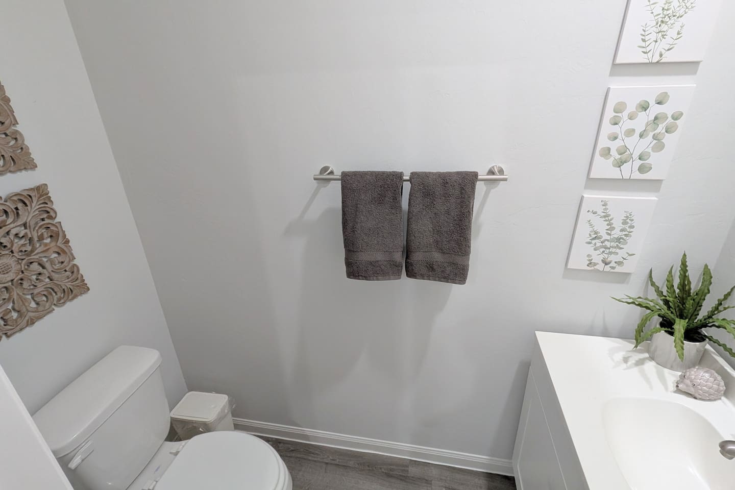 Spacious half bath located off the main living area. 