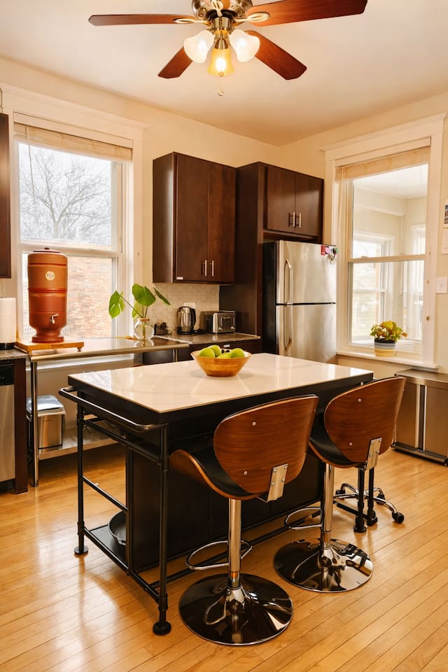Modern kitchen with full appliances and plenty of space to cook and gather.