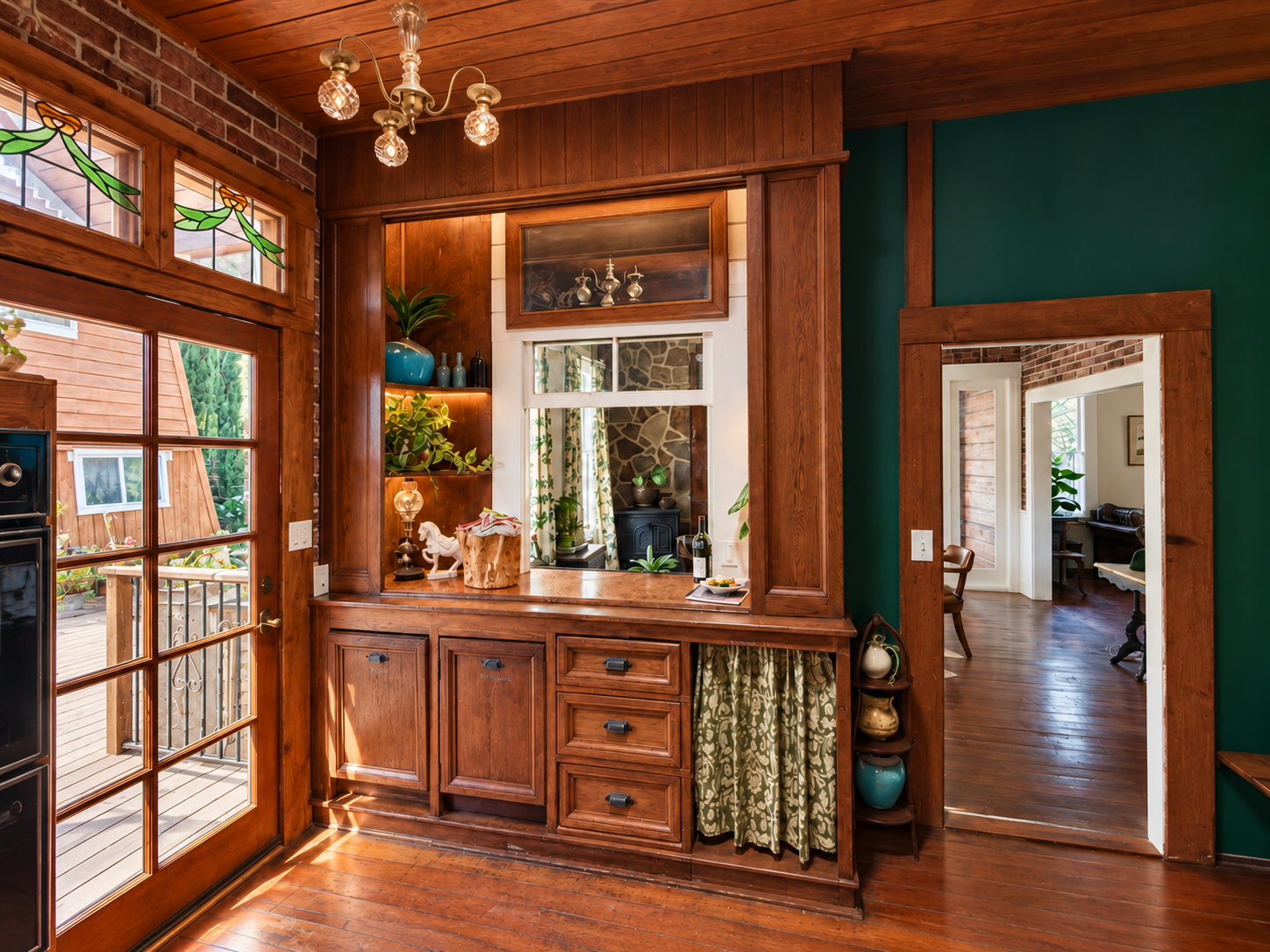 Designed to keep the cook in the heart of things: the kitchen connects to the dining room through a pass-through bar with operable window (part of the original house), Door opens to the back yard. High function, vintage soul.