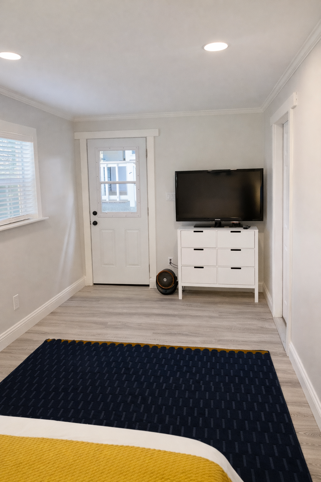 Enjoy added privacy in the detached guest bedroom, located just 10 feet from the main house. This comfortable retreat features a queen bed, Smart TV, and air conditioning, making it the perfect space to relax and unwind while staying close to the rest of y