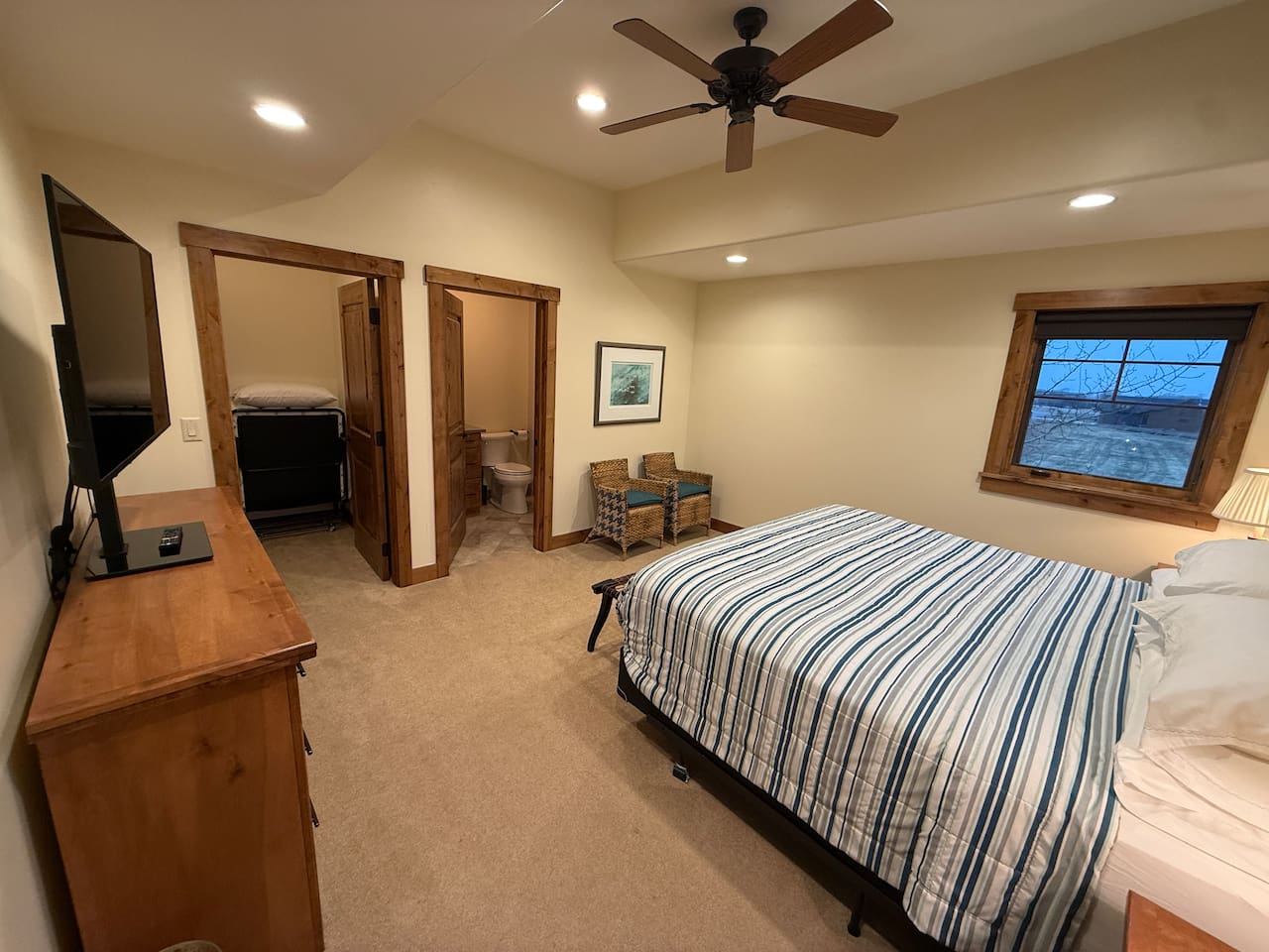Upstairs king bedroom with en suite bathroom and walk in closet.