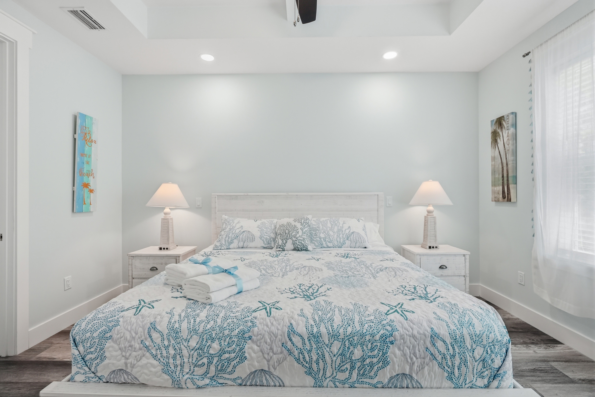 Relax in your main king bedroom at the end of a long day with a book.