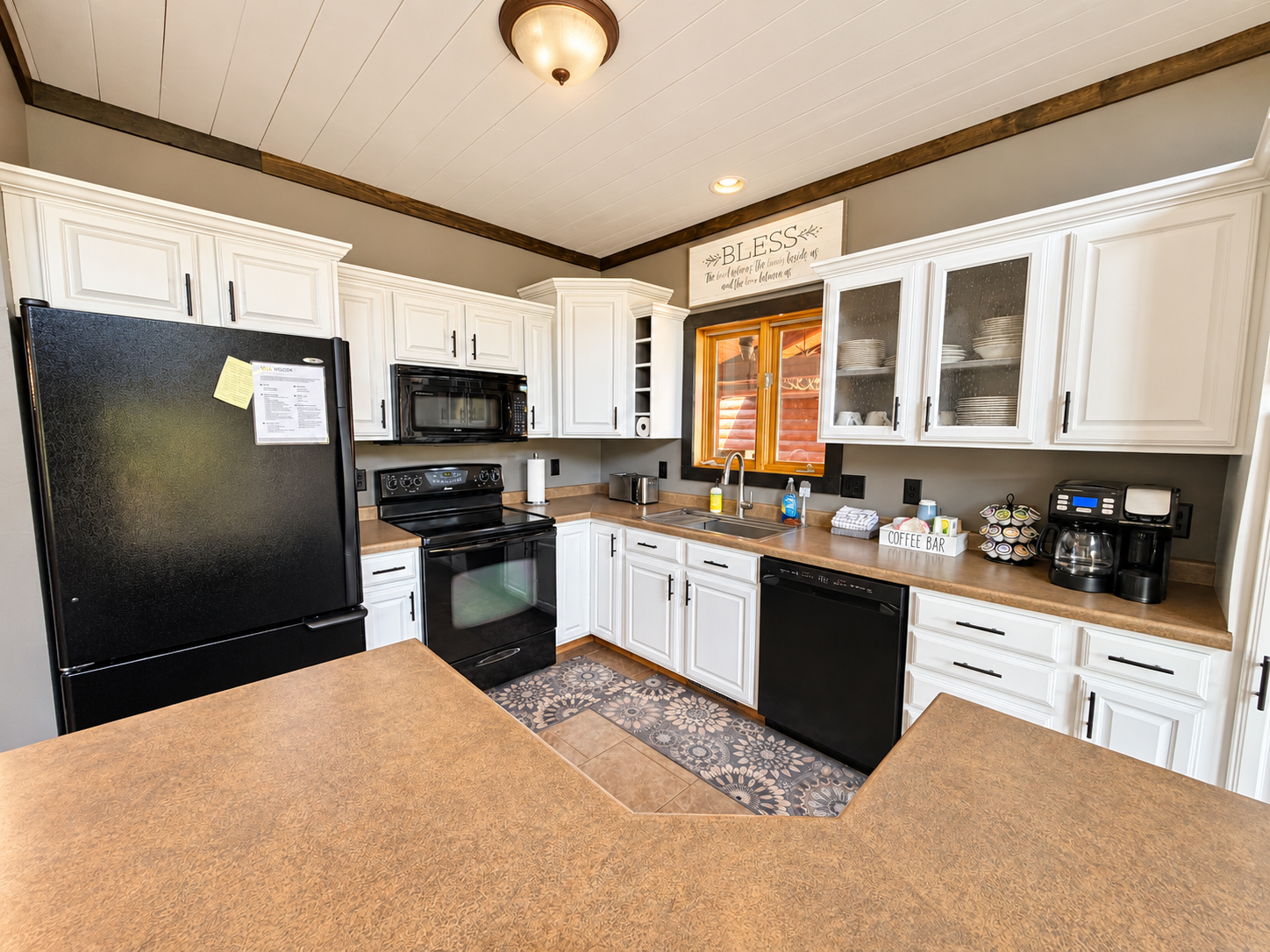 The fully stocked kitchen is ready for your stay, with modern appliances, a coffee maker, K-cups, and plenty of essentials for preparing everything from quick breakfasts to full group meals.