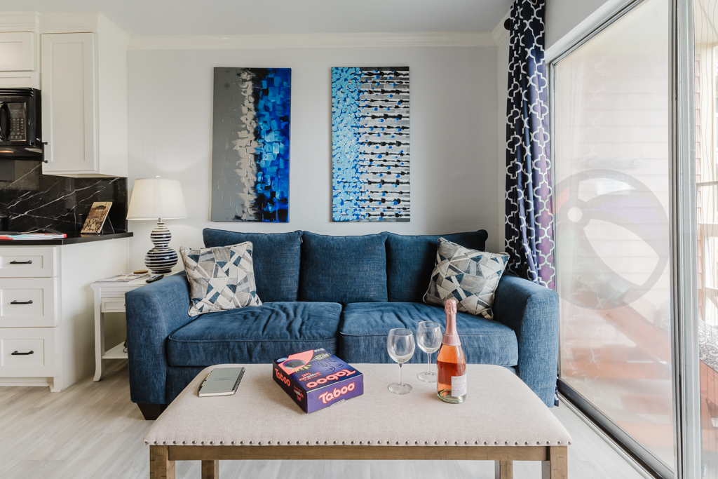 Comfy sofa - the bench shown here as the "coffee table" doubles as extra seating for the table, and the sofa pulls out to a queen bed