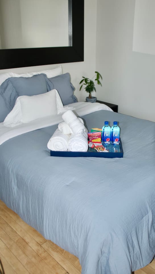 Comfortable bedroom with soft bedding and relaxing atmosphere.