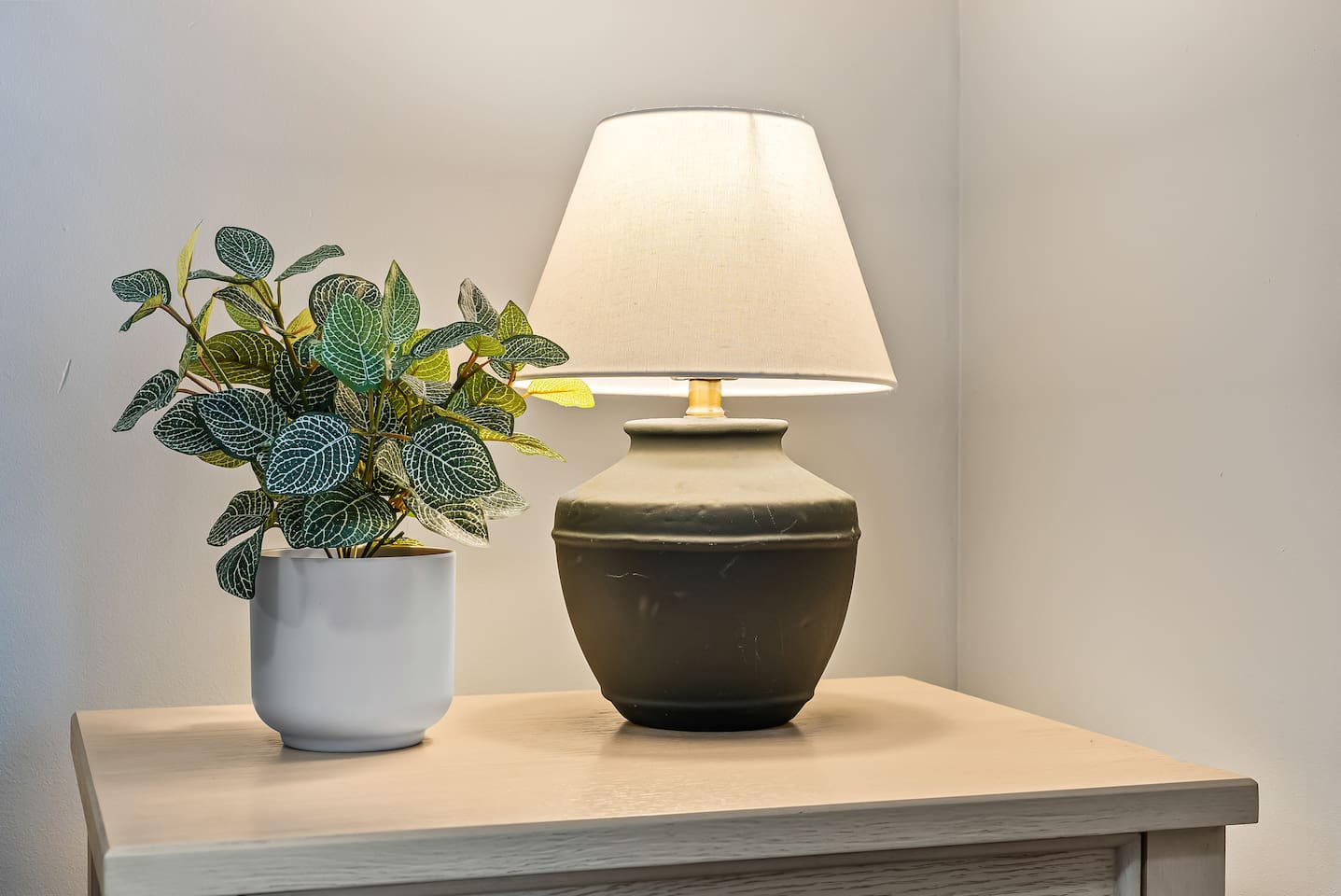 A warm bedside lamp adds just the right ambiance for evening reading.
