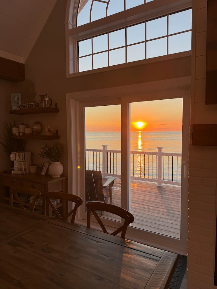 Unwind with a glass of wine and watch the stunning sunset paint the sky from this cozy dining area. It is the perfect, relaxing setting for friends and family to gather and enjoy a dream vacation by the ocean.