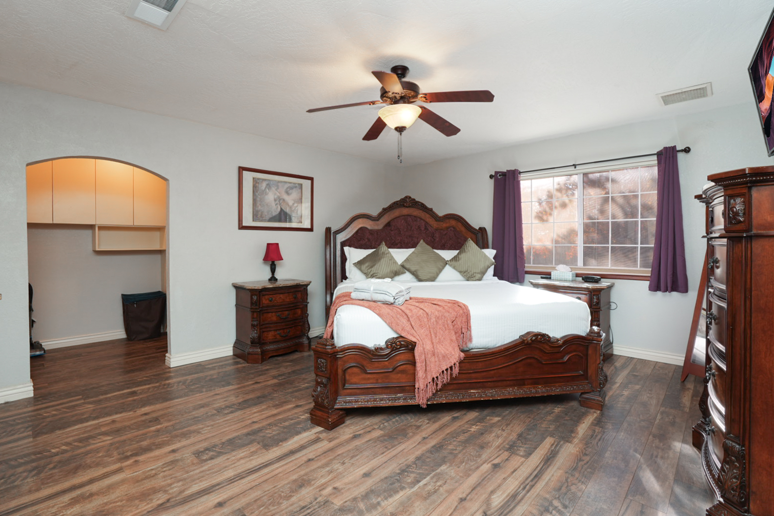 Unwind in the comfort of the primary retreat featuring a plush king bed, smart TV, and plenty of room to stretch out after a day of adventure.