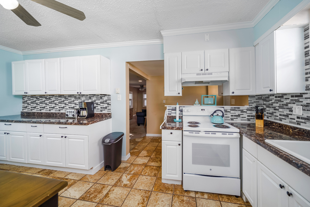 Need some extra space to whip up breakfast or coffee? Enjoy this second fully stocked kitchen.