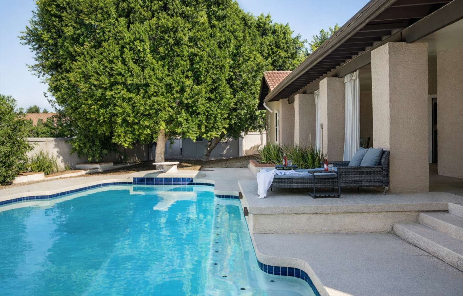 Unwind by the heated pool with plush seating and total privacy for the perfect desert getaway.