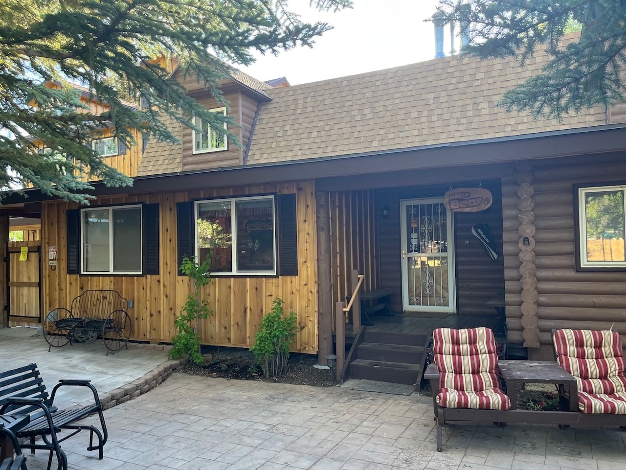 Front porch area with patios and lawn furniture are just waiting for you to enjoy.