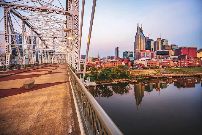 John Seigenthaler Pedestrian Bridge – Skyline sunset views (12–14 min walk)