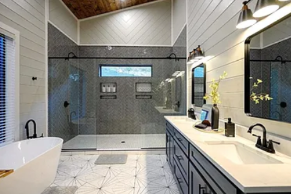 Luxurious bathroom with walk-in shower and dual vanity.